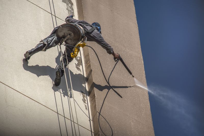 Powerwashing a building facade